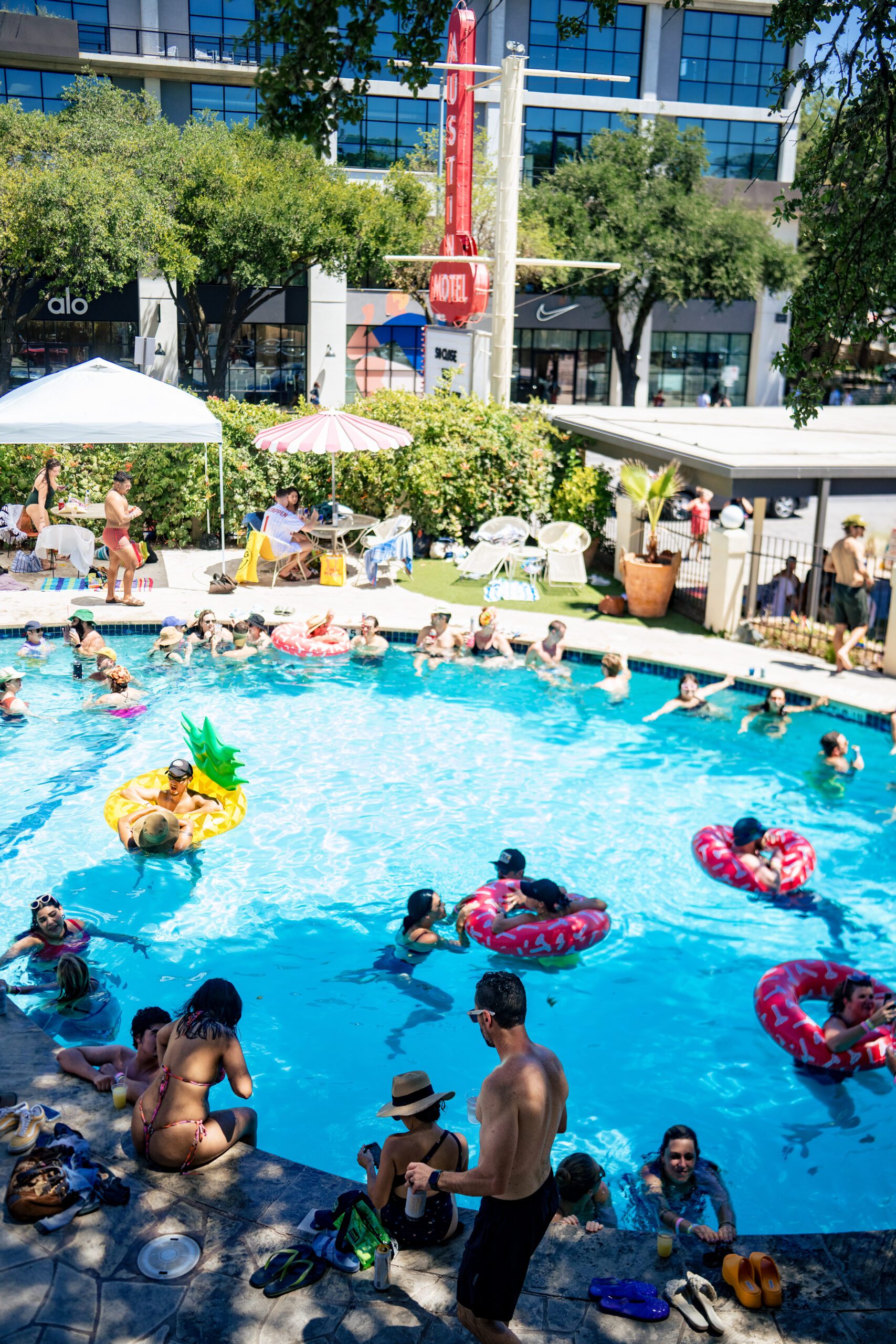 People enjoying an outdoor pool