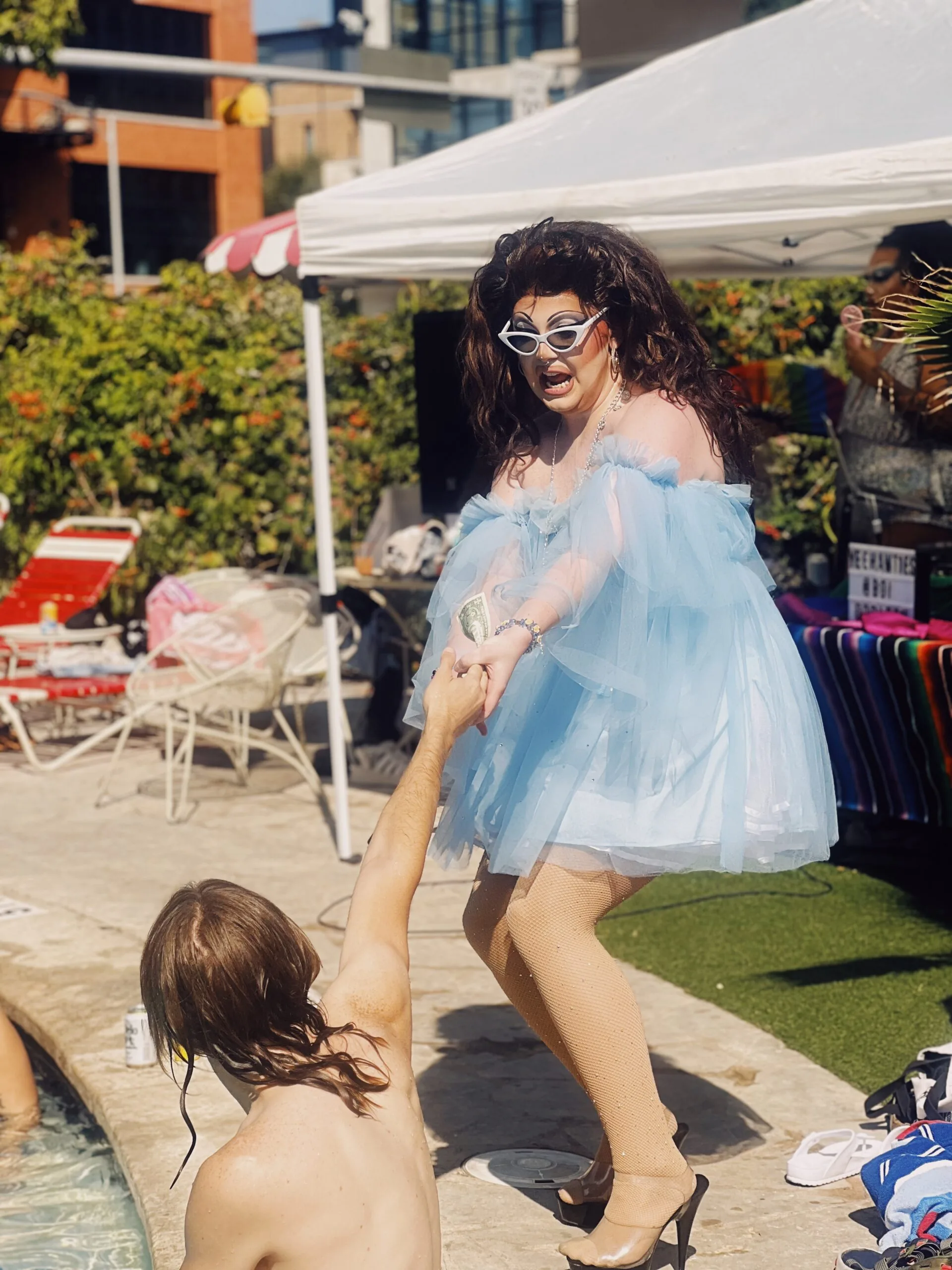 person dressed in drag poolside