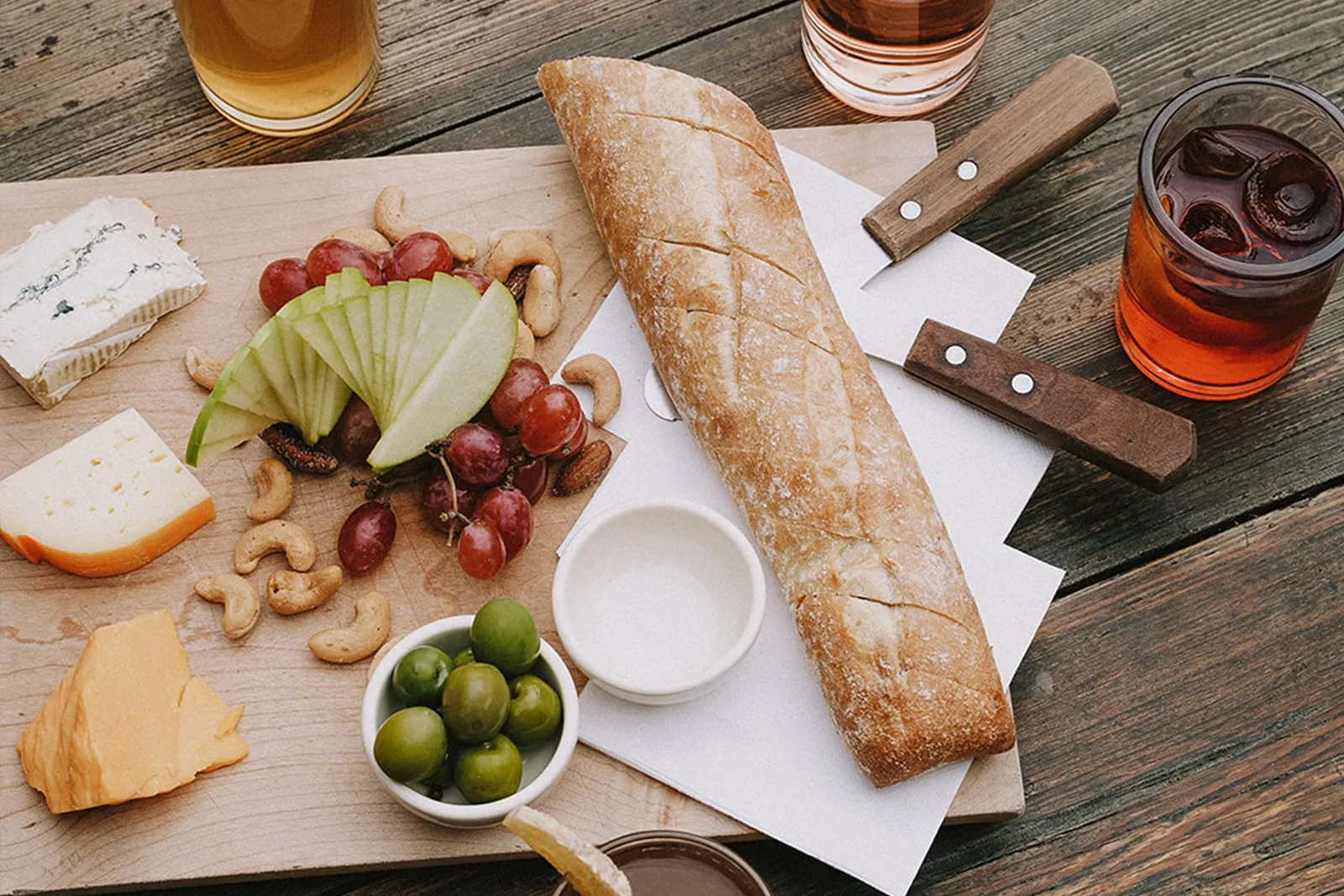 bread and snacks on wooden board