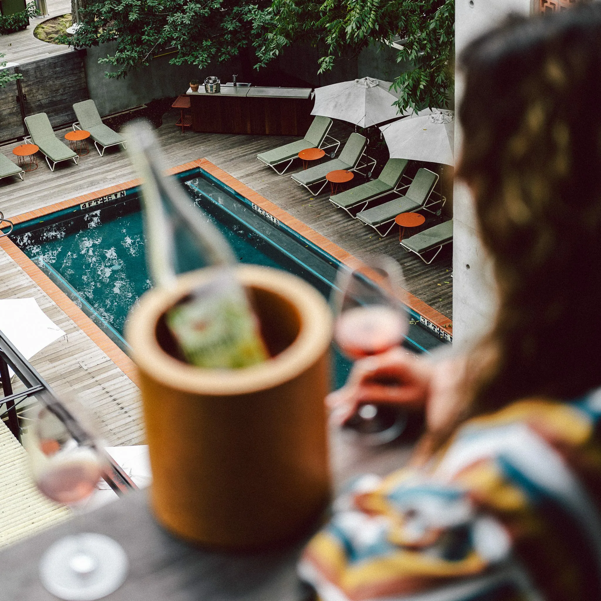 View of the swimming pool from an upper floor window