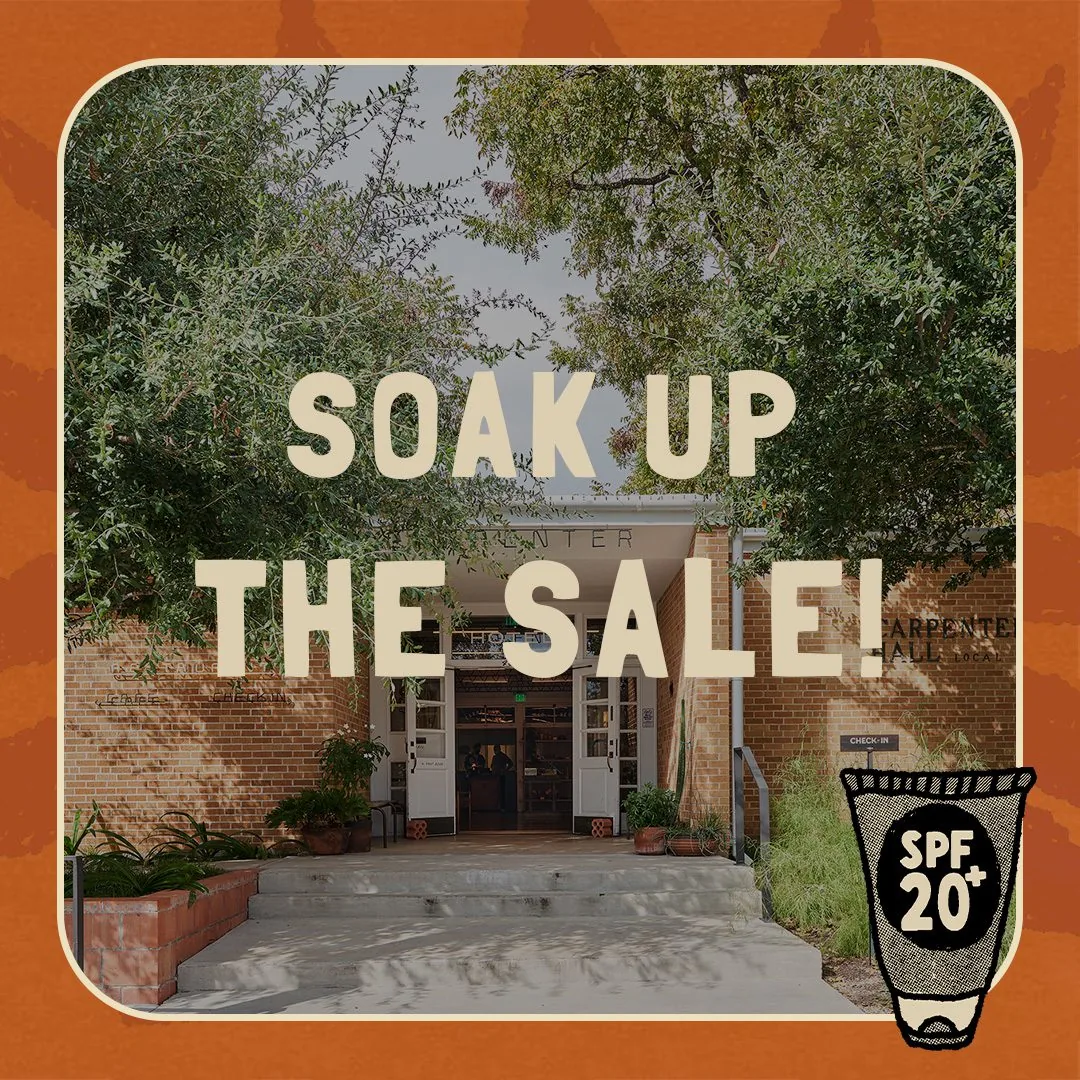 A sign reading 'soak up the sale'