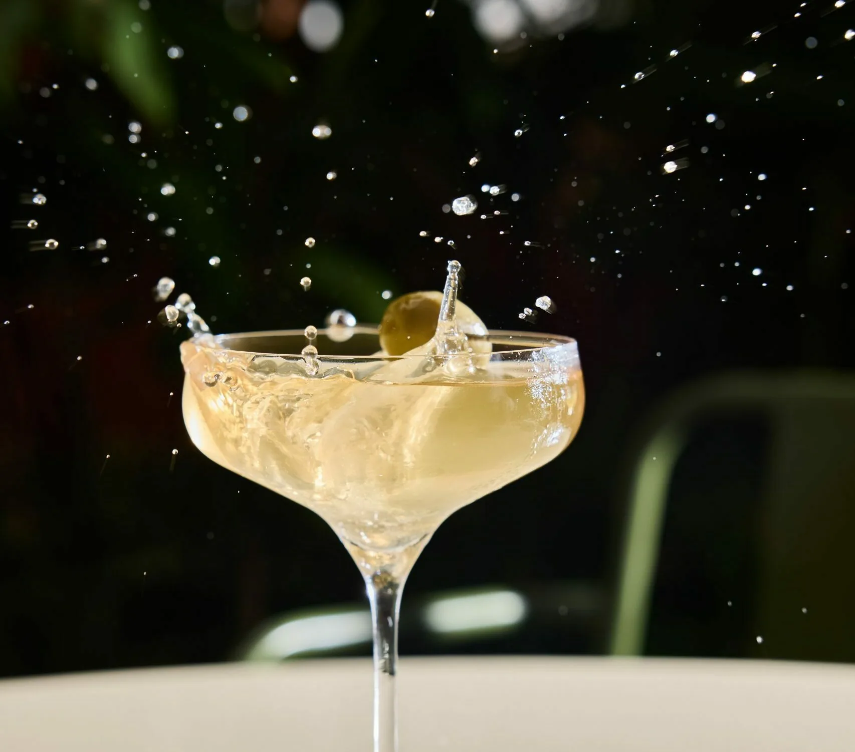 A cocktail in a long-stemmed glass