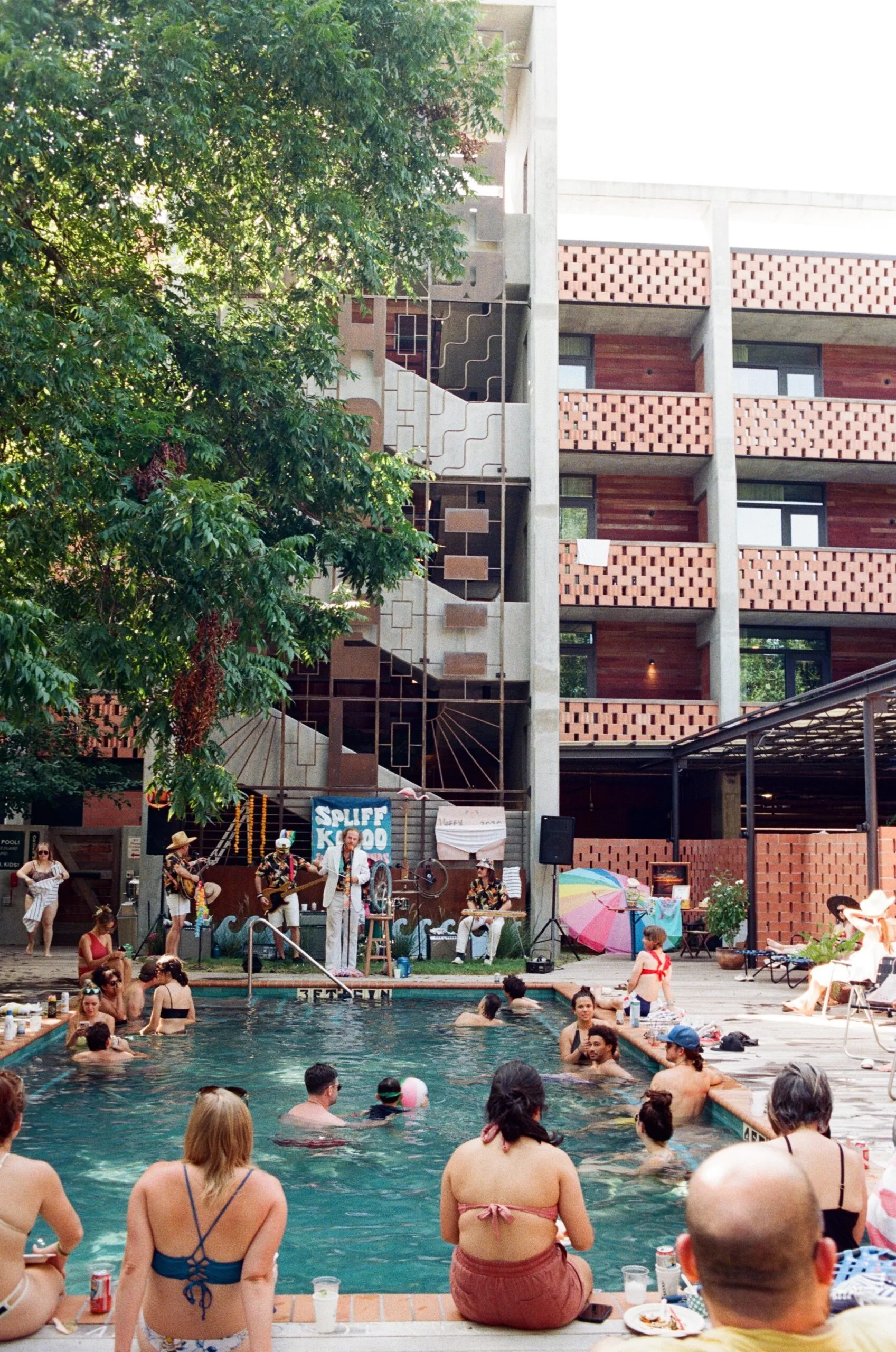 Guests enjoying the outdoor pool at Carpenter Hotel