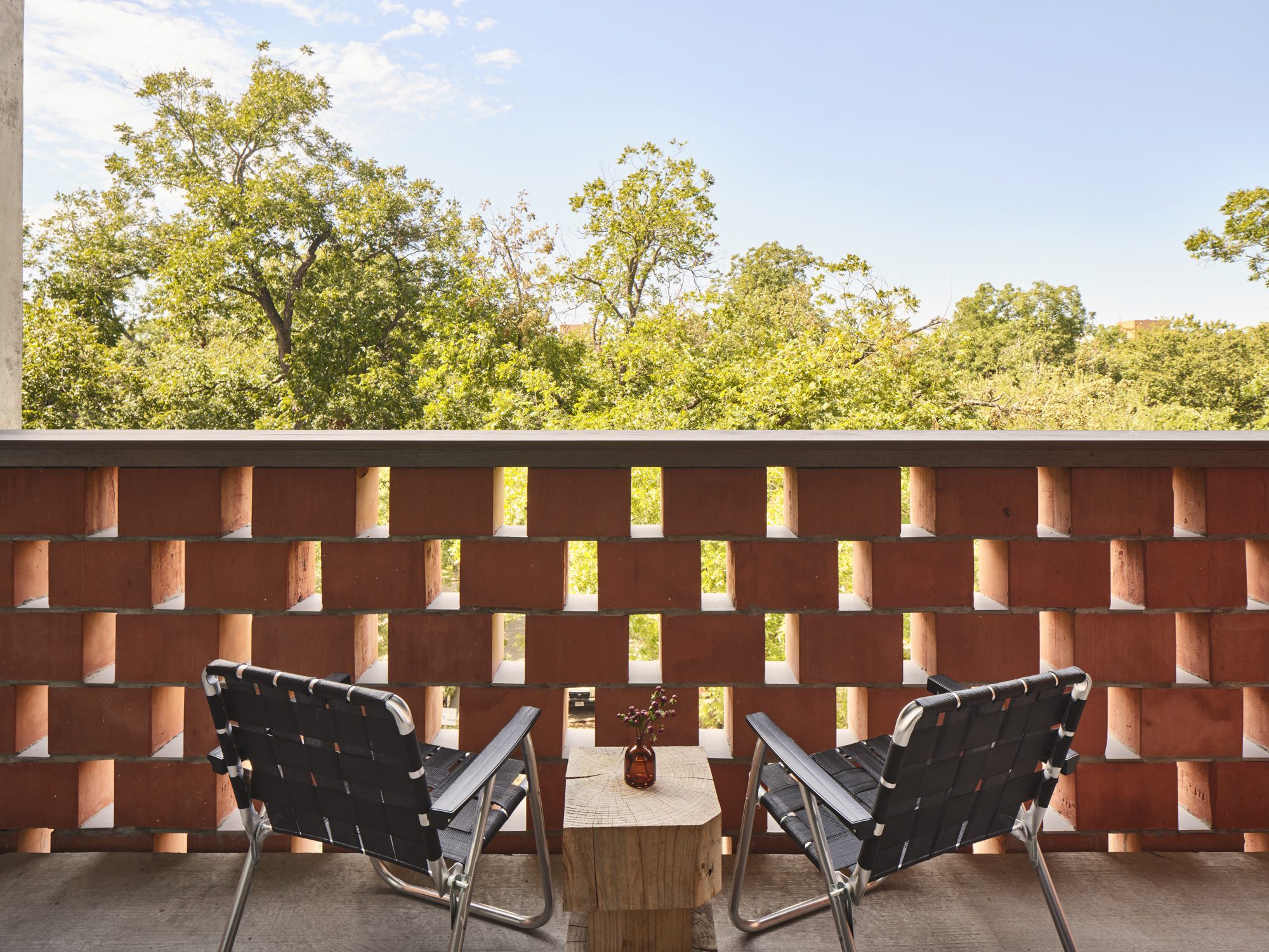 Seating area with two folding chairs on the Standard Double suite patio