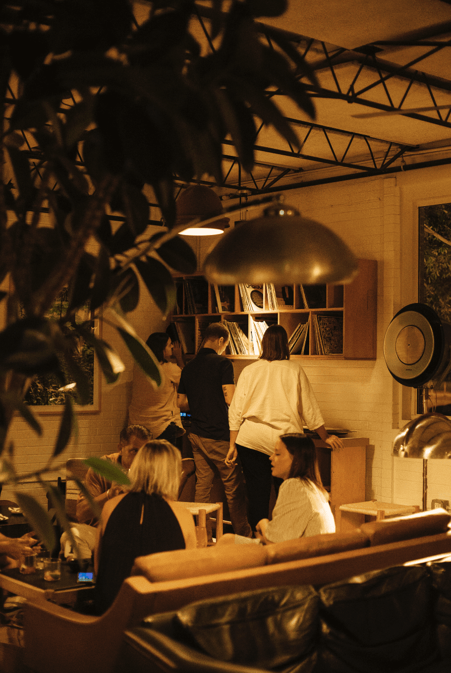 People conversing in a communal area at nighttime