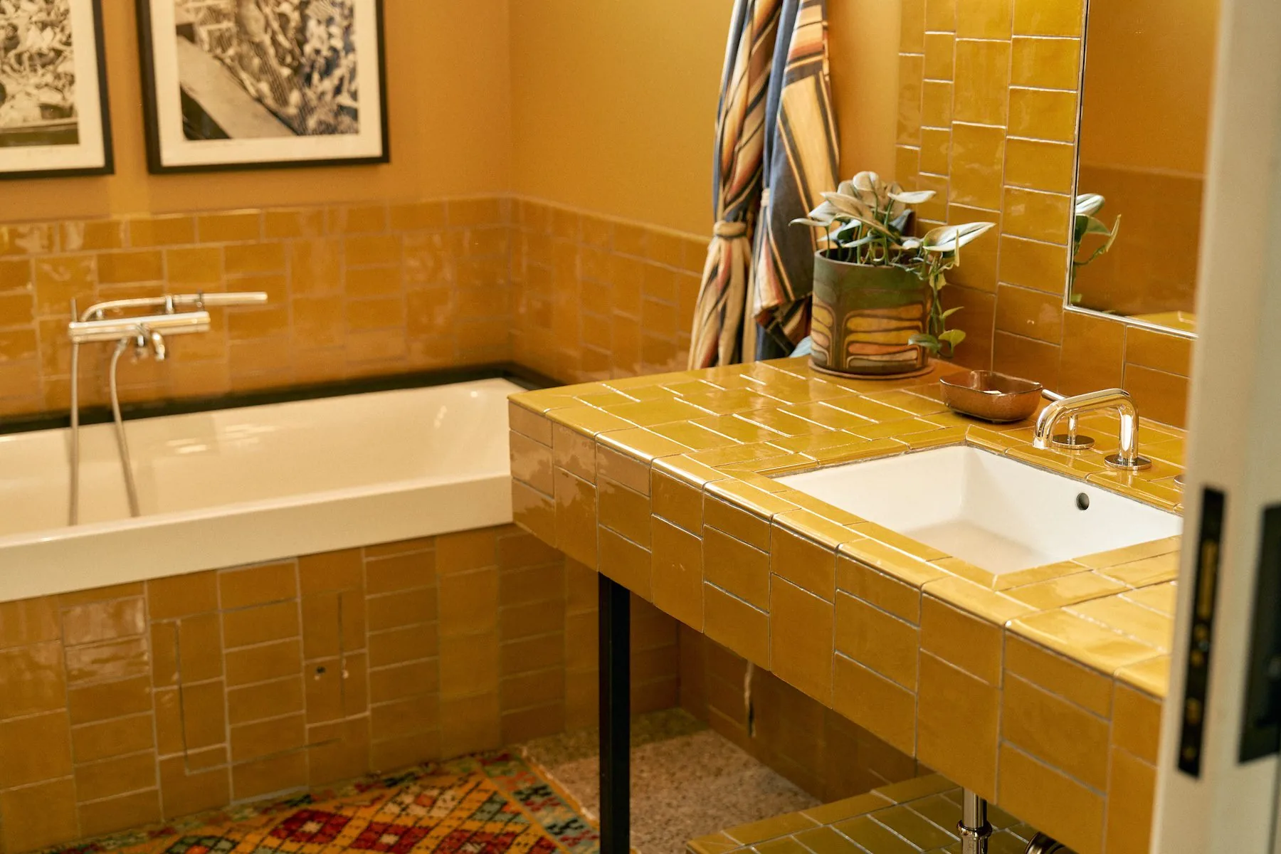yellow tile bathroom sink and tub