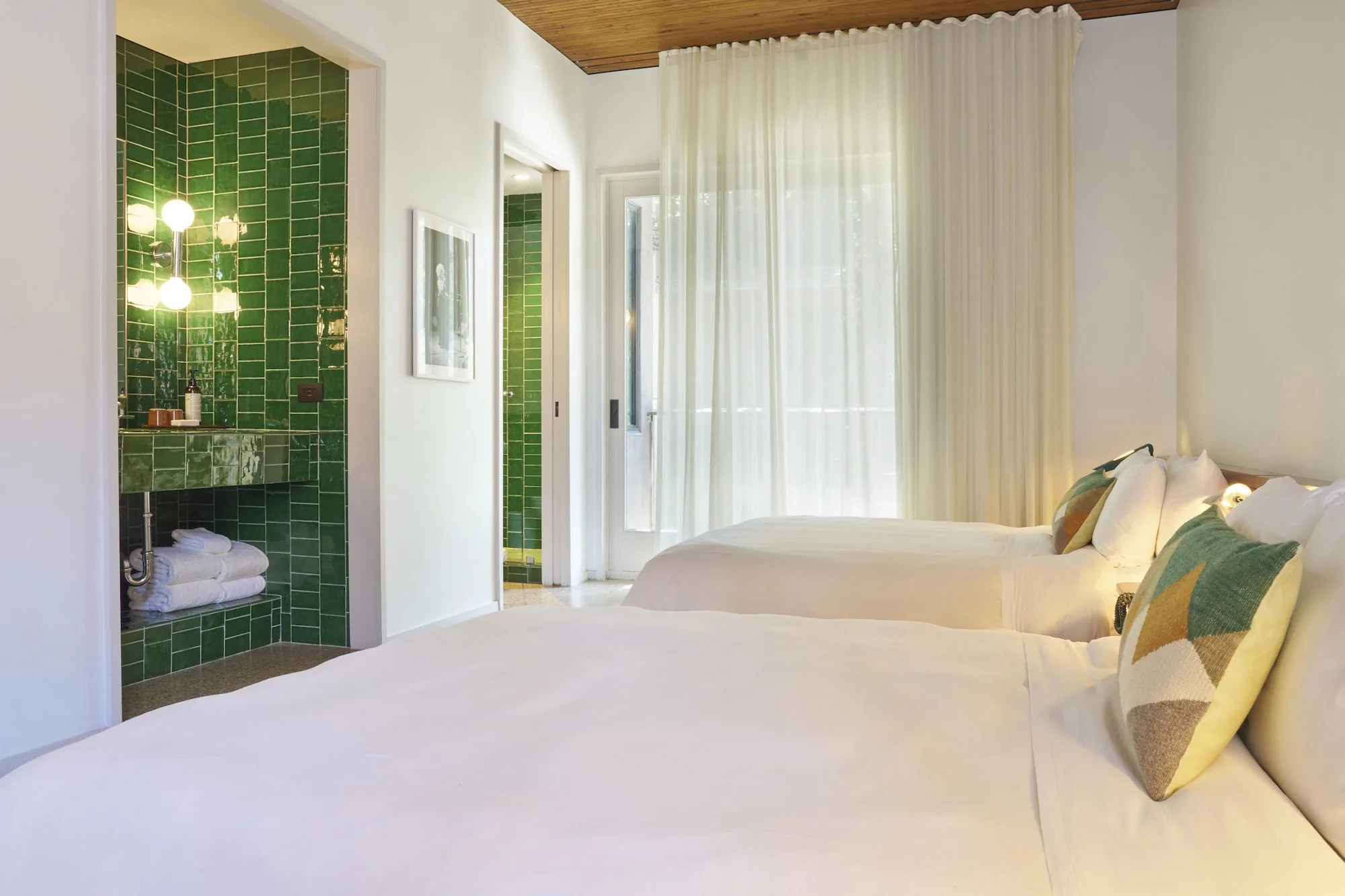green tile room with two beds