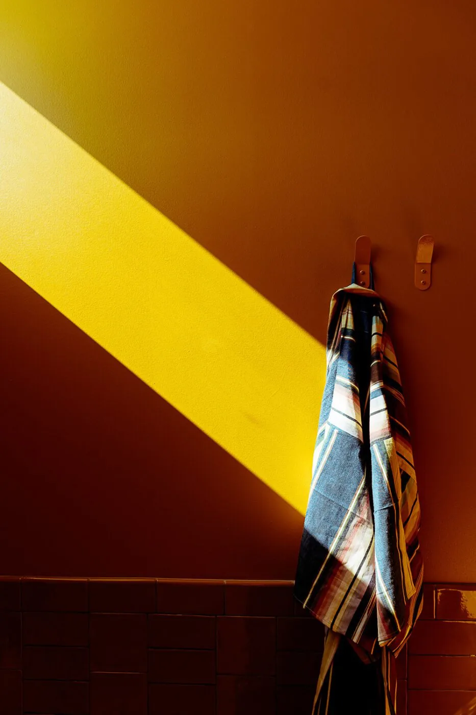 A robe hanging in the sunlight