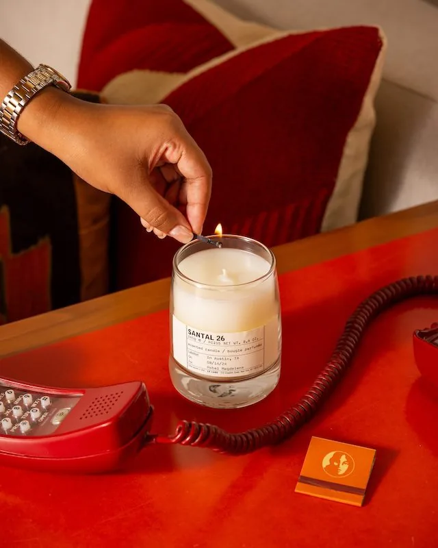 Le Labo candle being lit