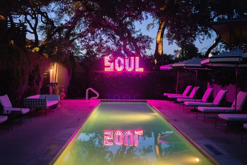 Hotel pool with neon SOUL sign
