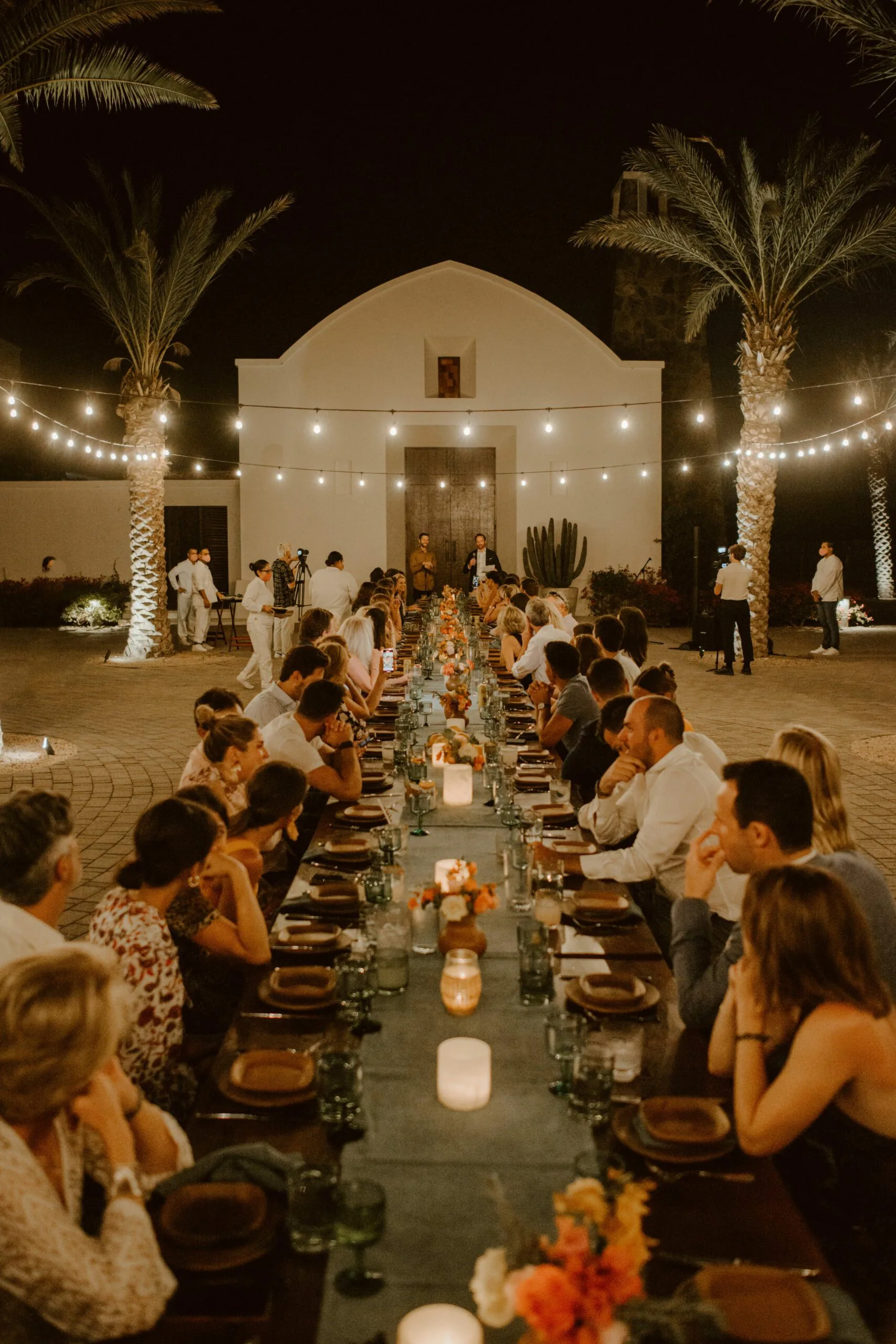 View down a long table at a wedding dinner