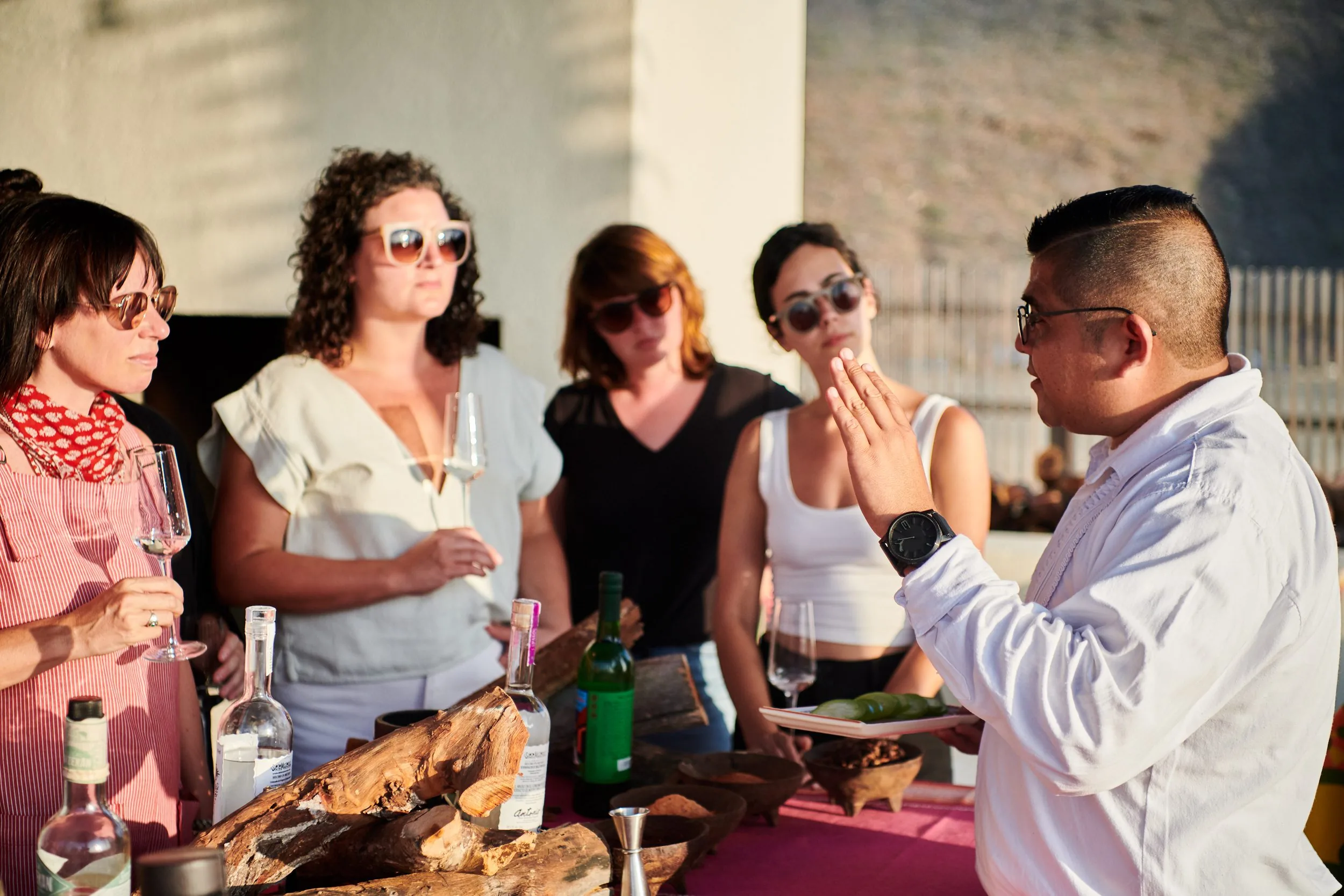 A group of people doing mezcal tasting