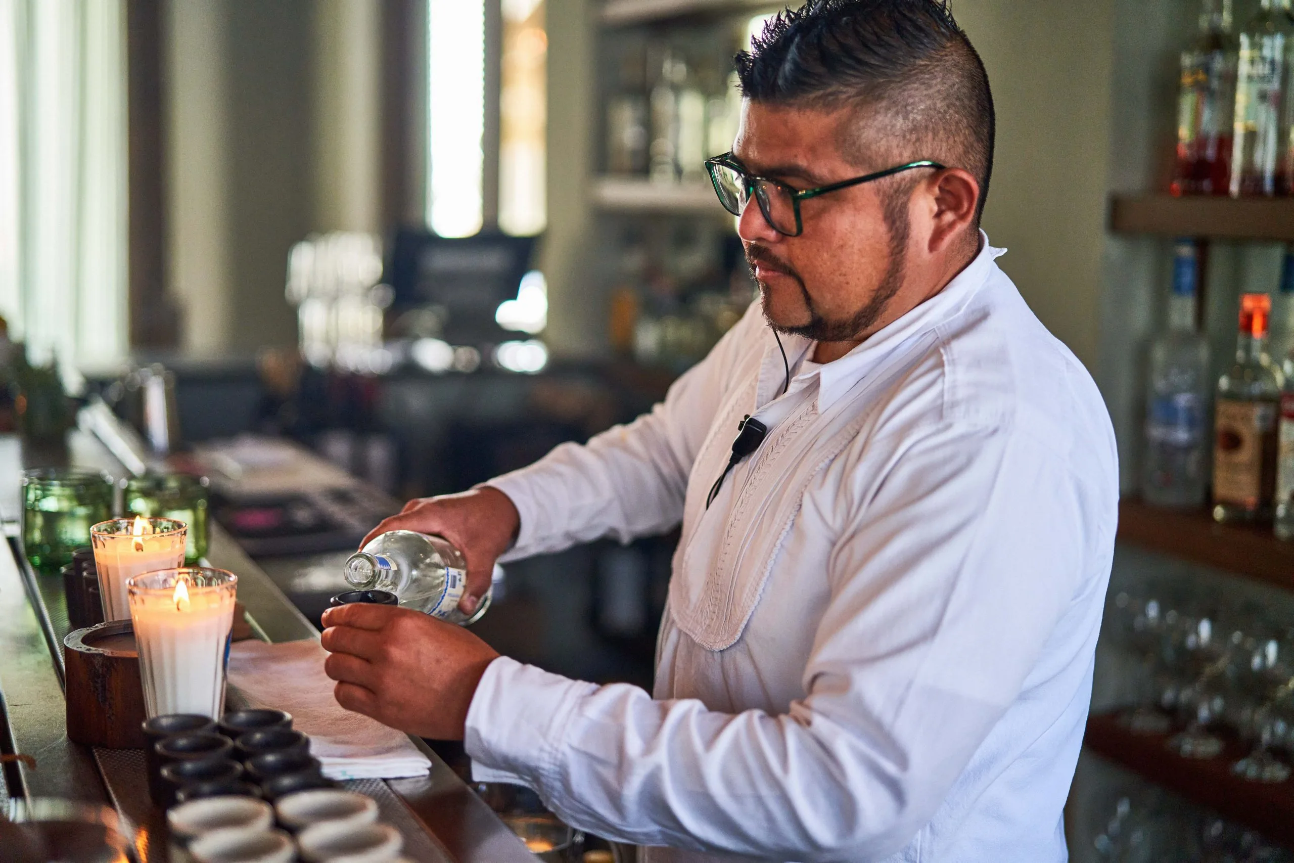 Mezcal being poured into a copita