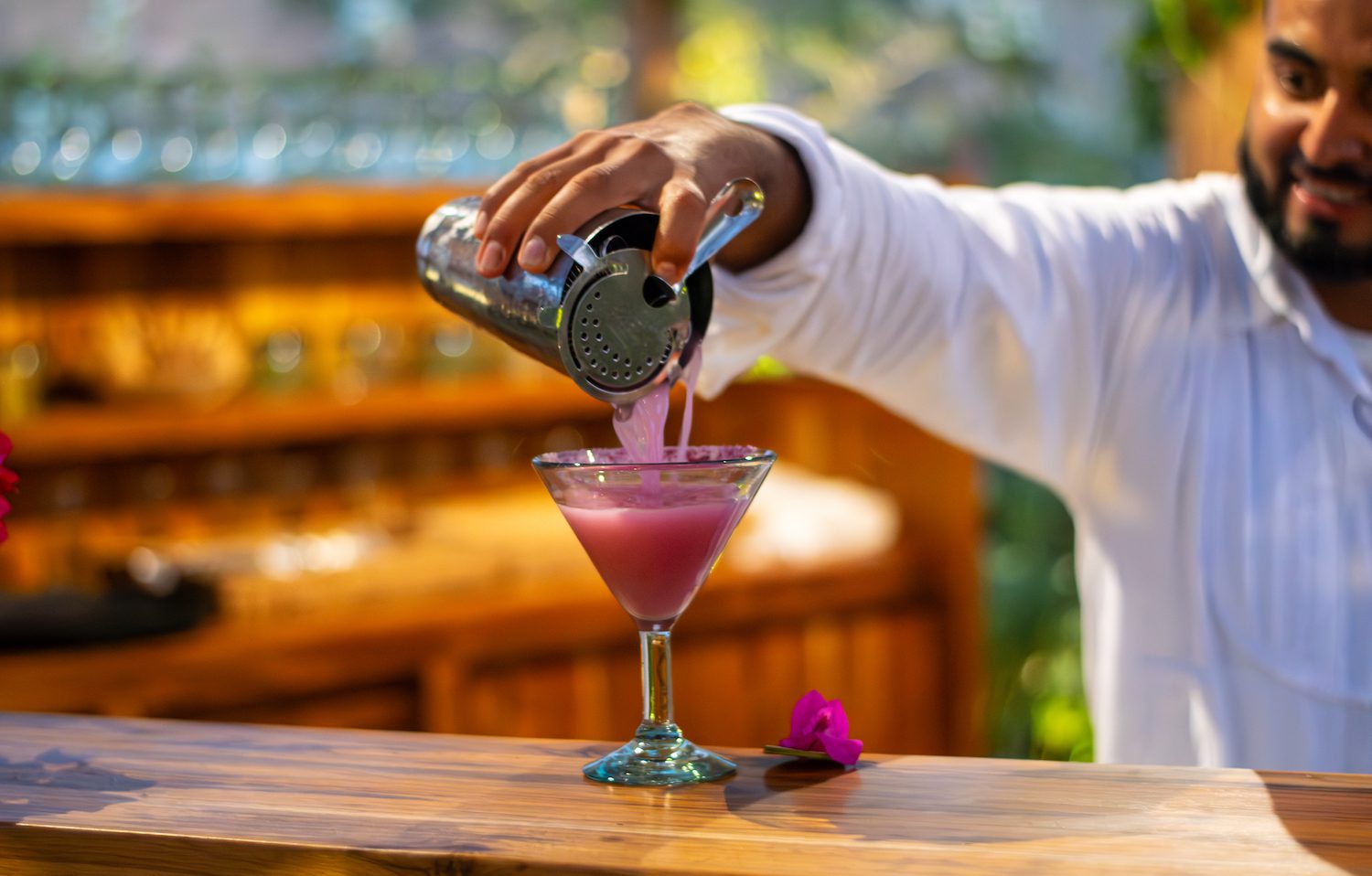 cocktail being poured by bartender
