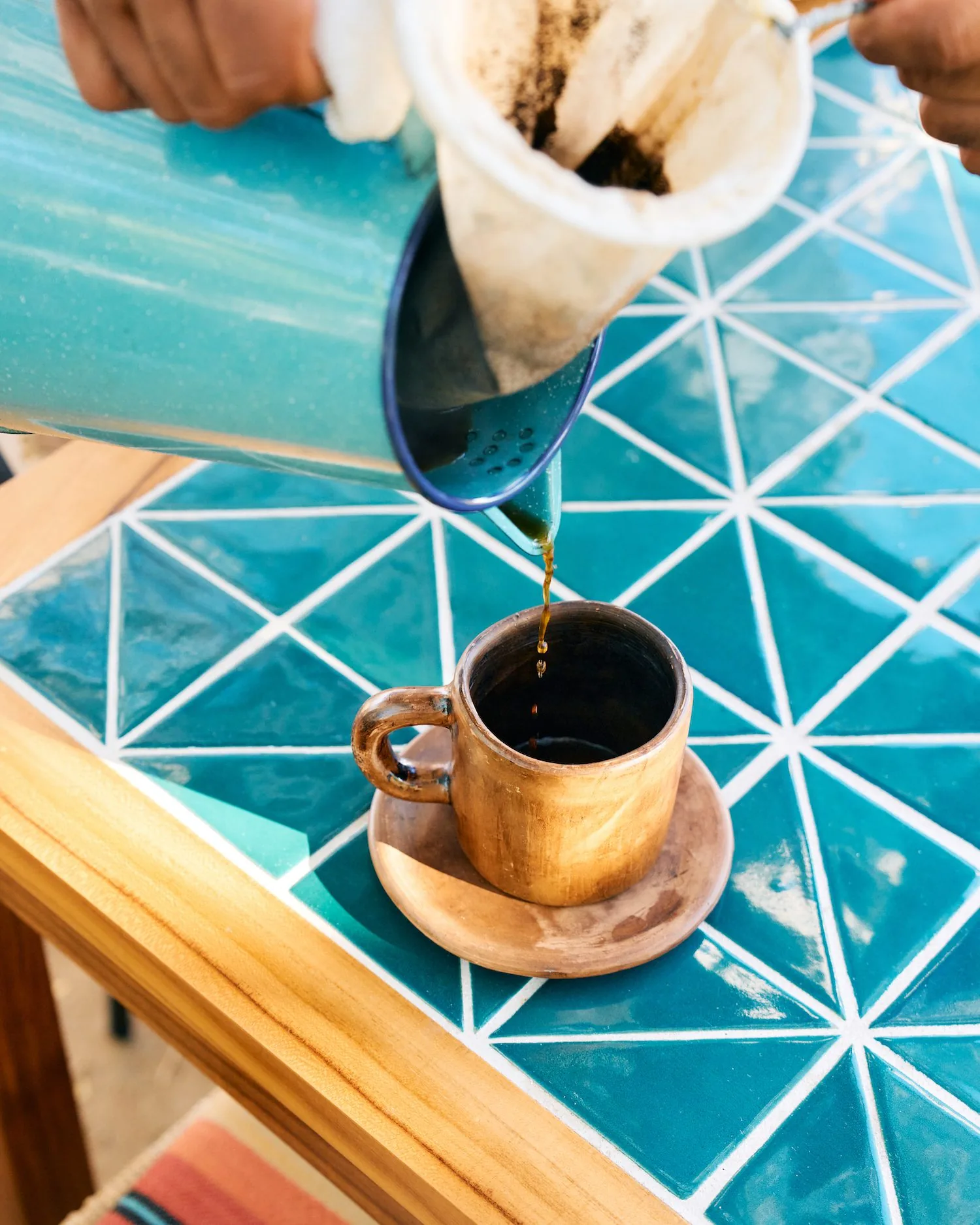 coffee being poured into a mug