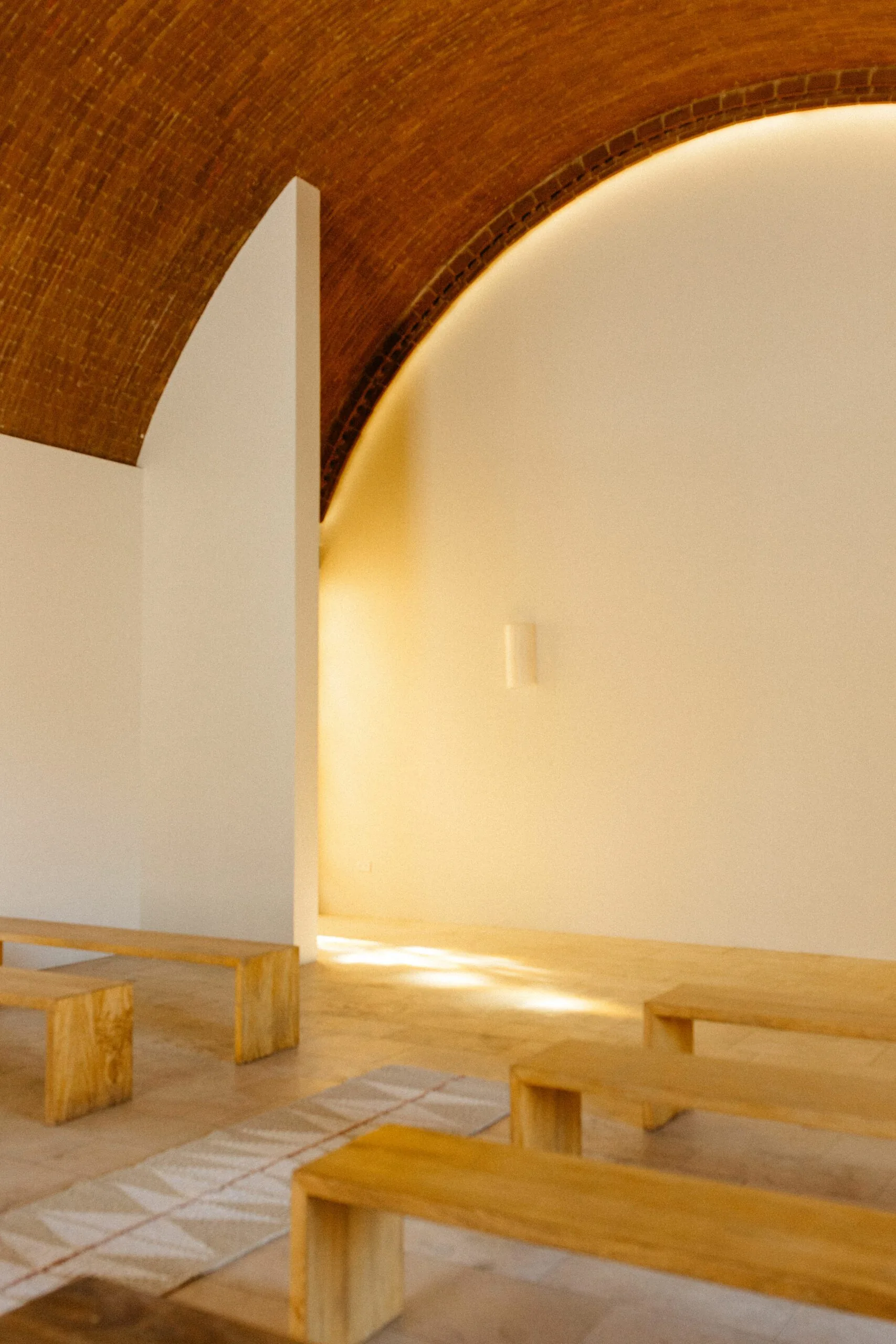 A wedding ceremony layout with wooden benches