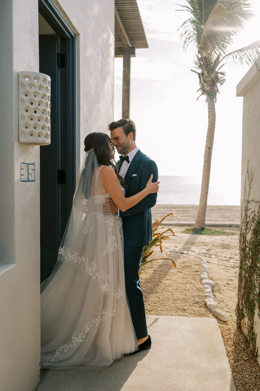 A wedding couple embracing