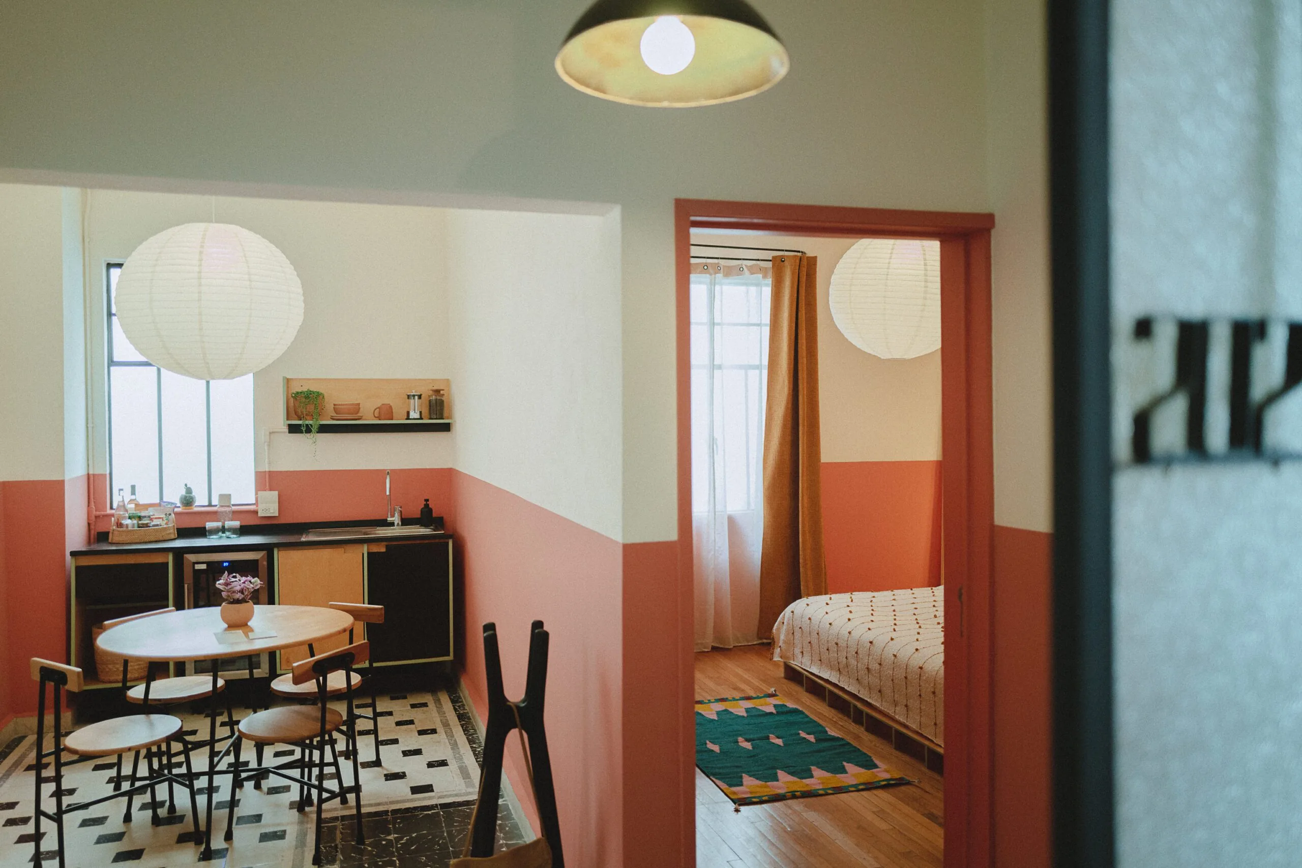 View of kitchenette area and doorway to bedroom in suite