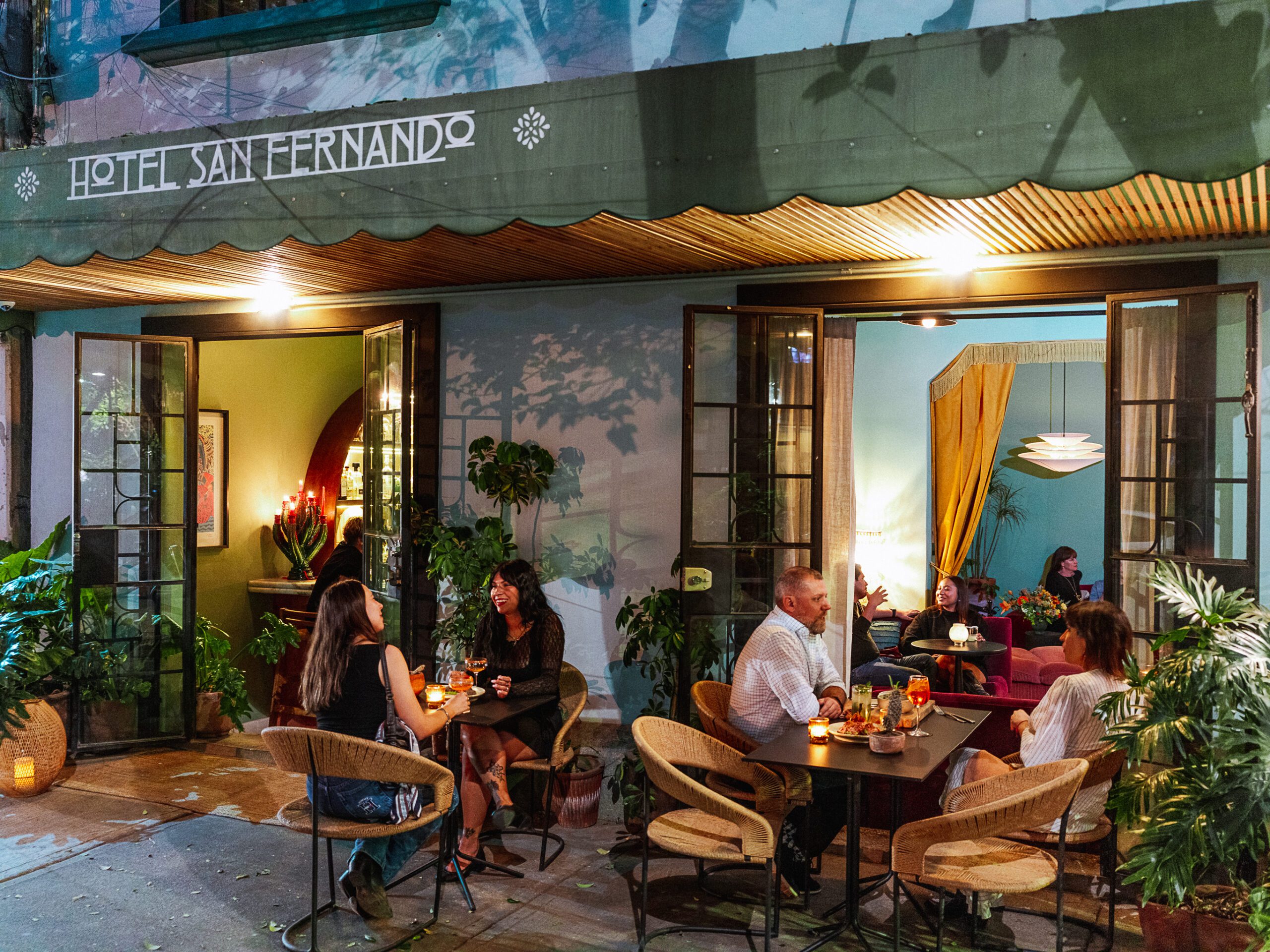 Guests enjoying drinks in the outdoor courtyard