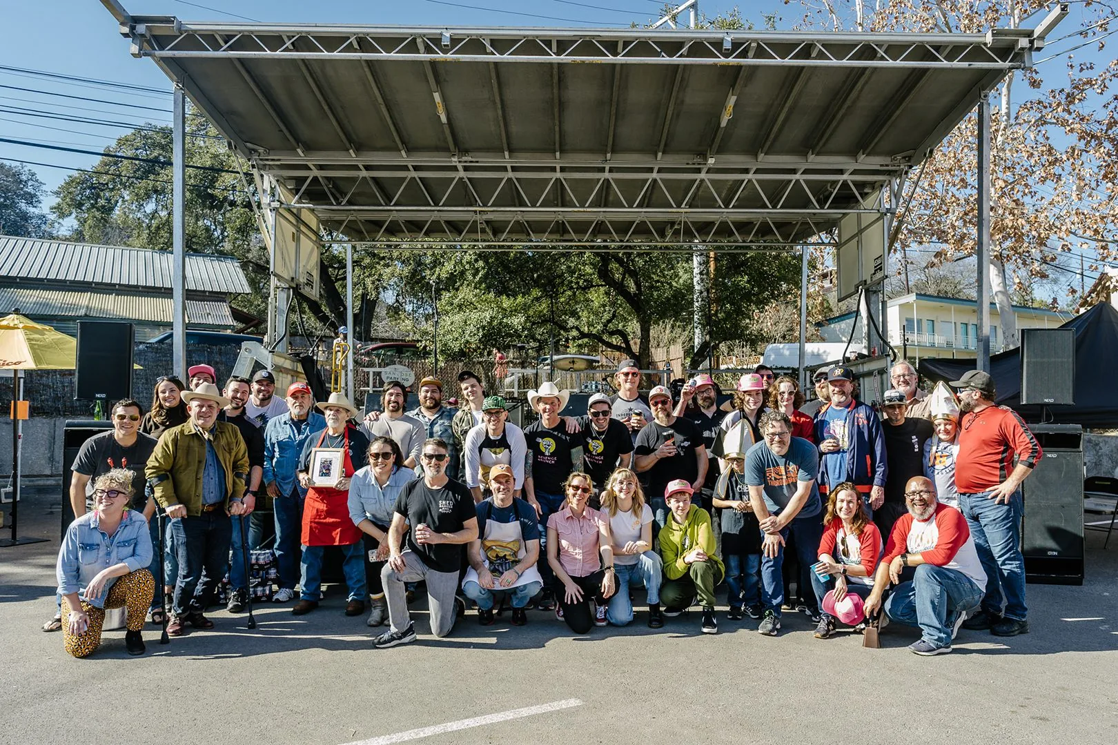 A large group shot of people participating in the chilli cook-off