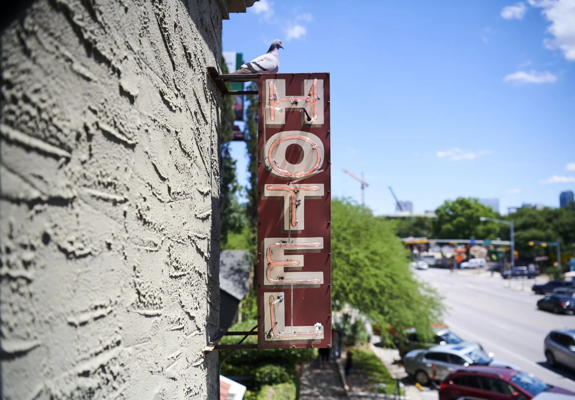 vertical hotel sign on building exterior