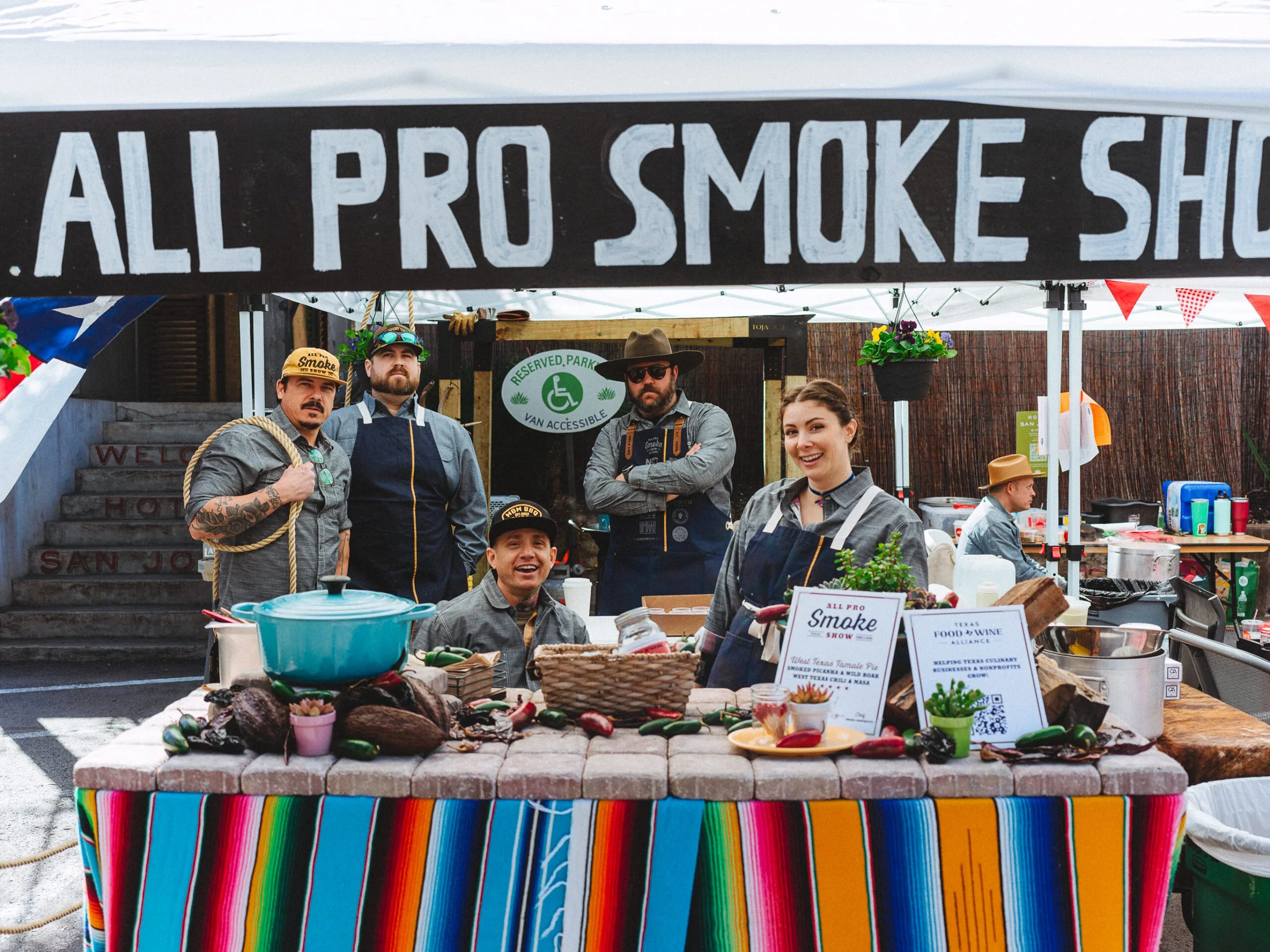 All pro smoke show sign. 5 people posing for the camera