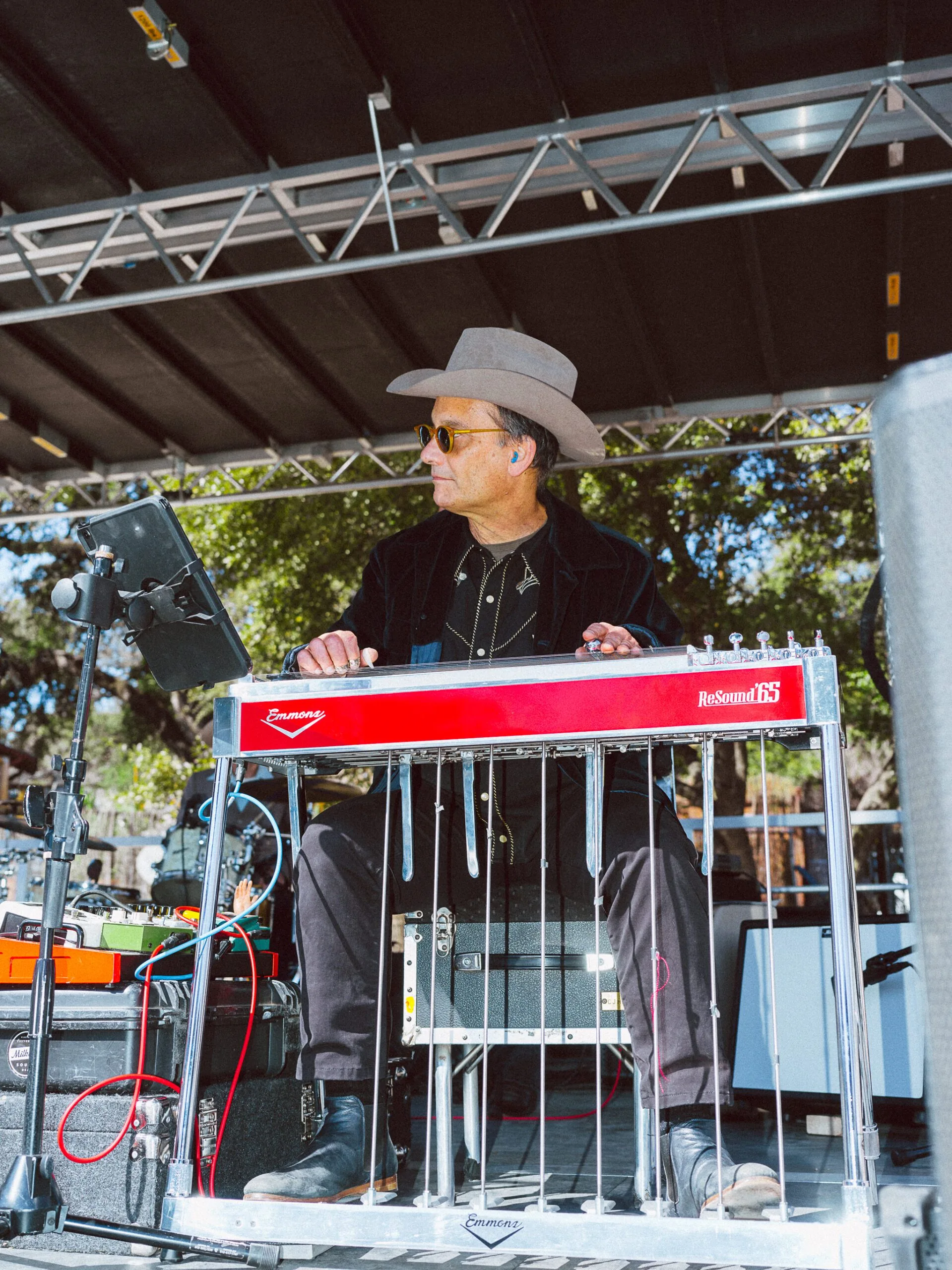 man sitting at a sound machine