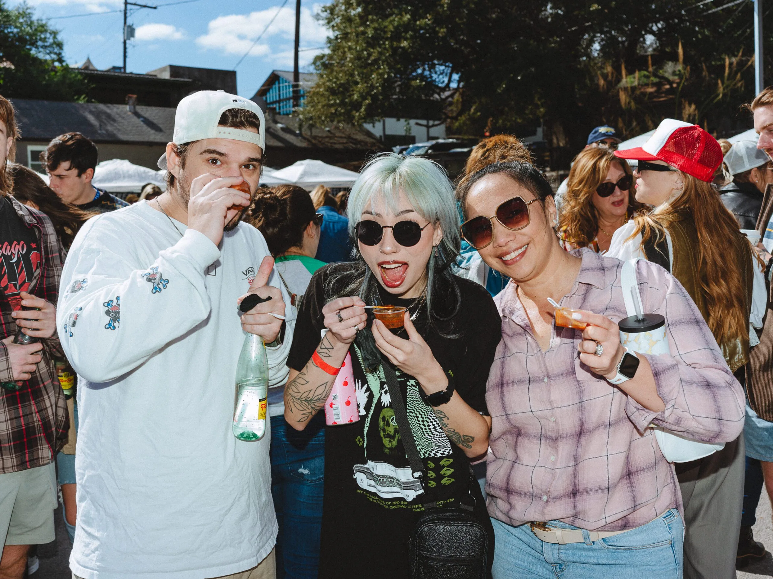people eating chilli samples and smiling for the camera