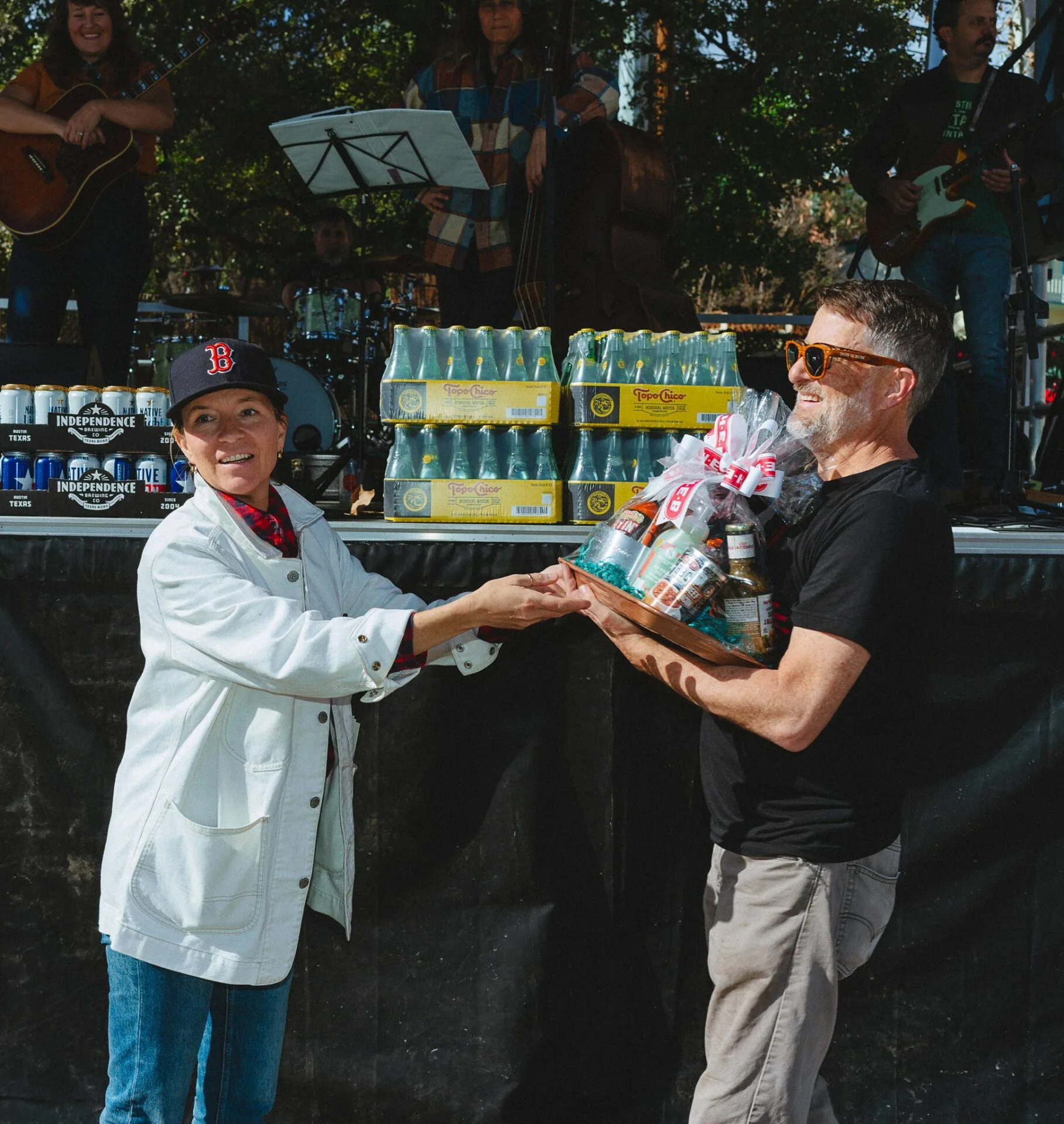 woman handing a man a gift package