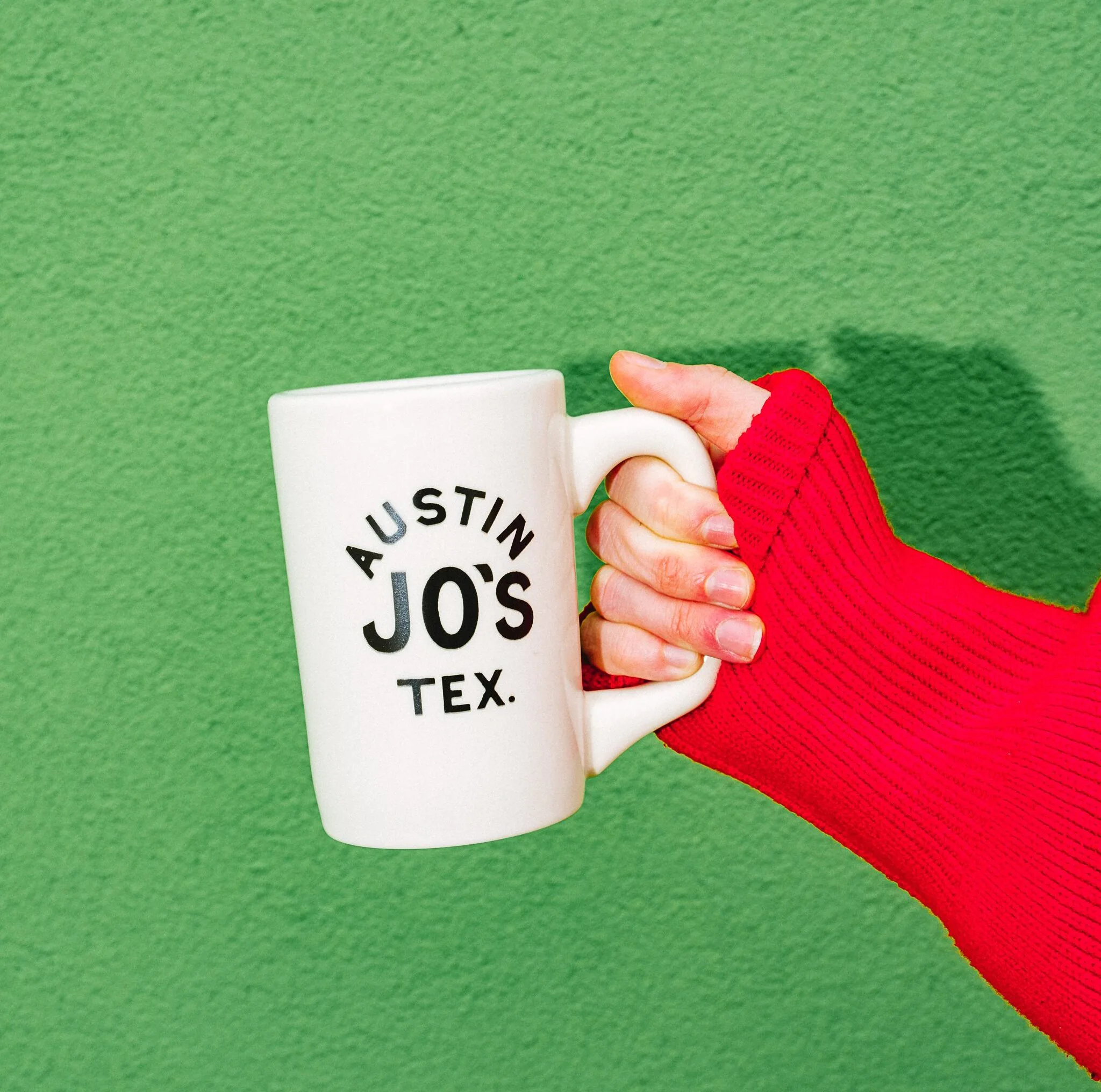 hand holding Jo's mug