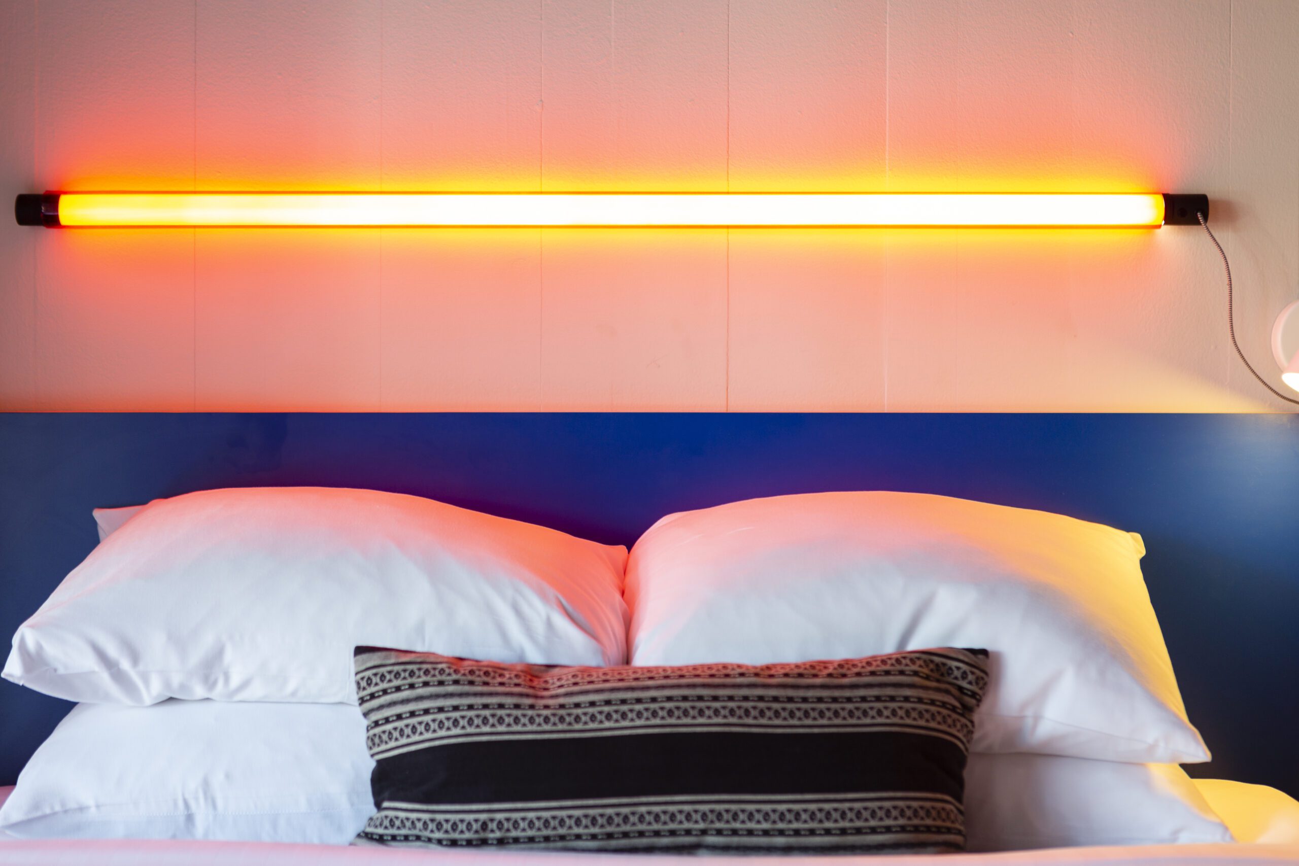 bed with pillows and lights