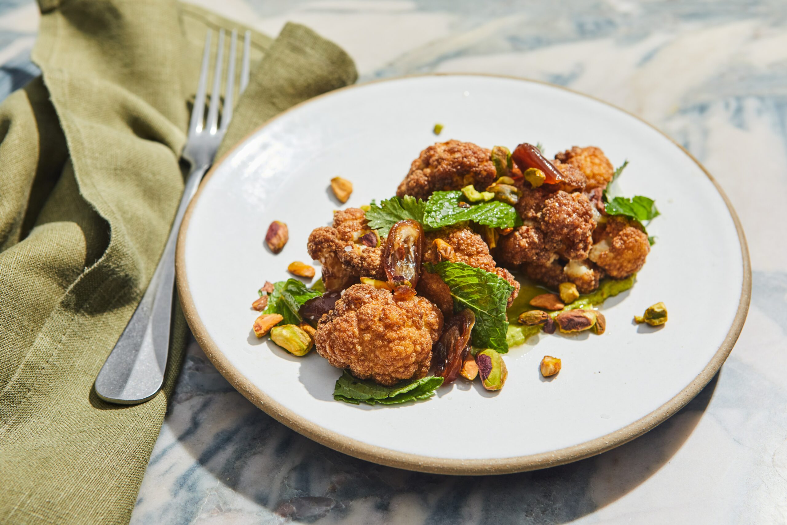 ROASTED CAULIFLOWER with pickled dates, mint, serrano, pistachio butter