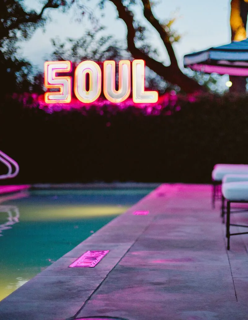Hotel Saint Cecilia pool at night with the SOUL neon lit up