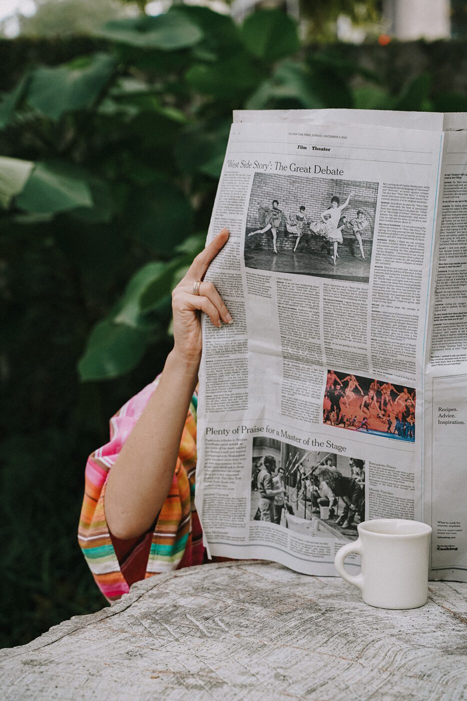 person reading newspaper