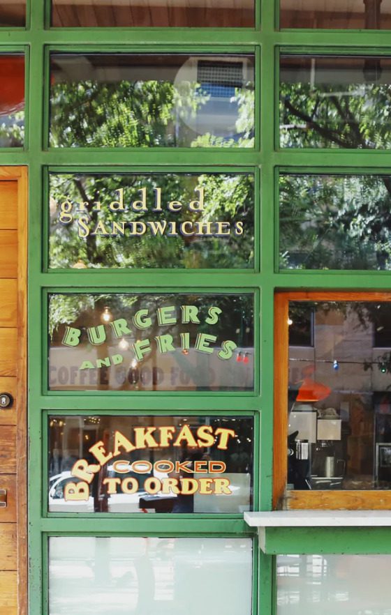 Jos Coffee window with various phrases