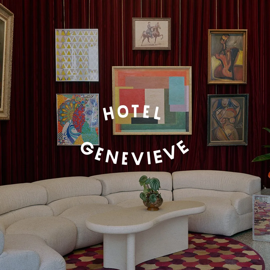 Hotel Genevieve logo over lobby sofa
