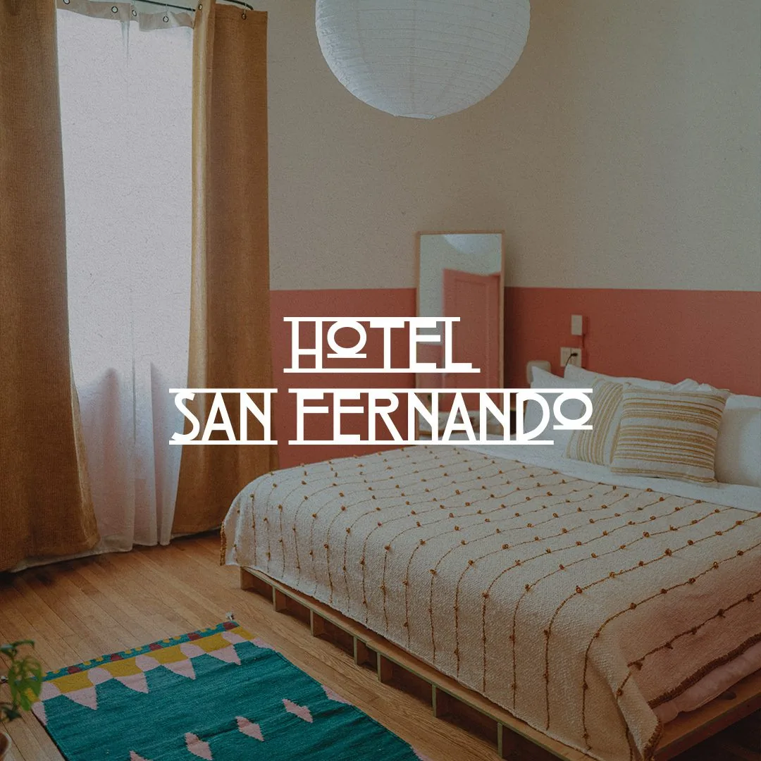 Hotel San Fernando logo over a shot of the room