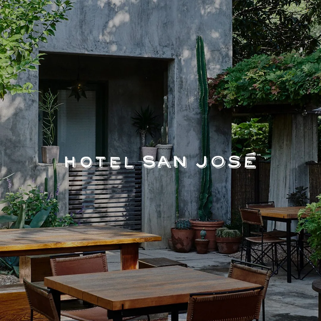 Hotel San Jose logo over a picture of the courtyard