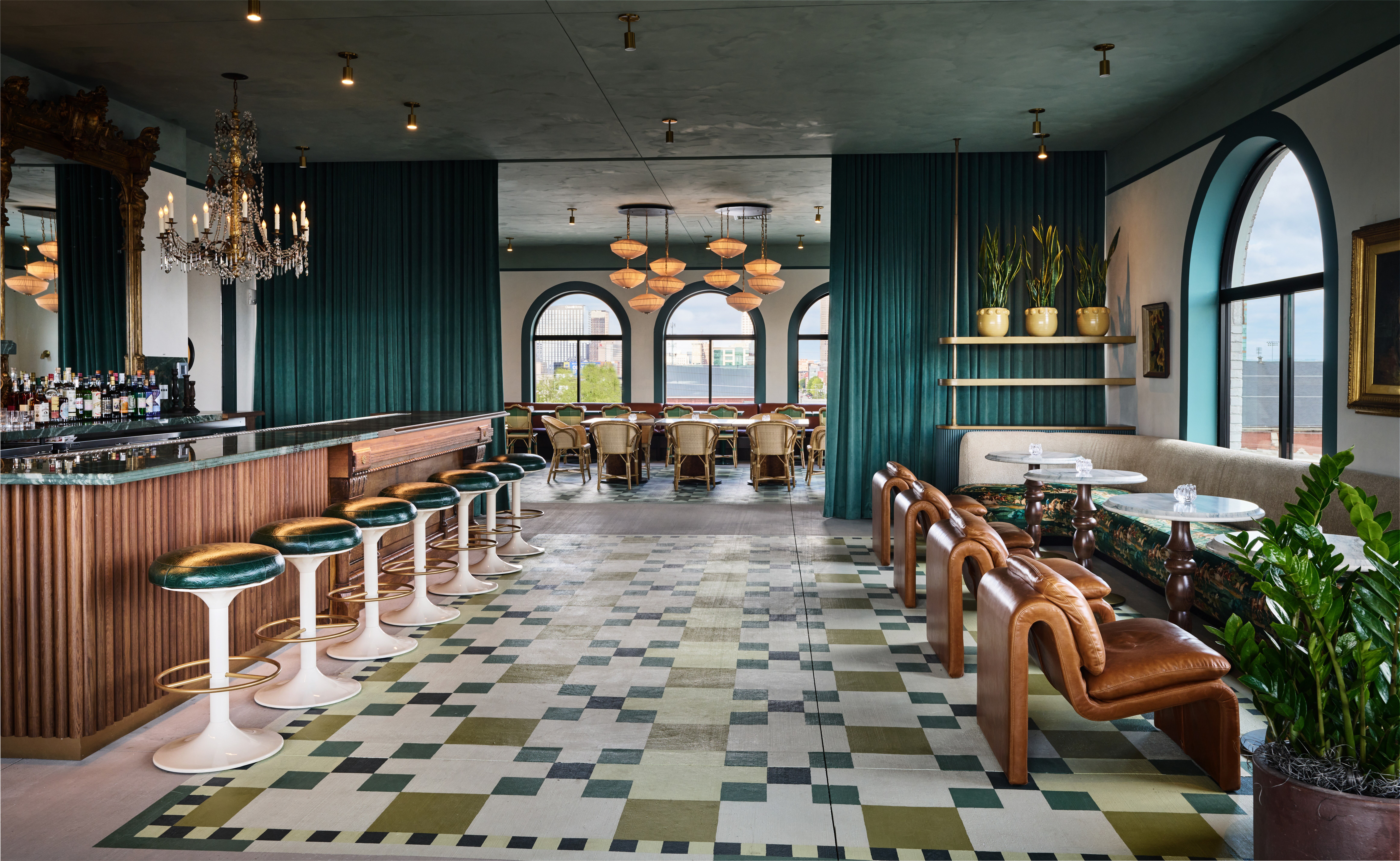 Wide shot of bar with painted floors and multiple tables