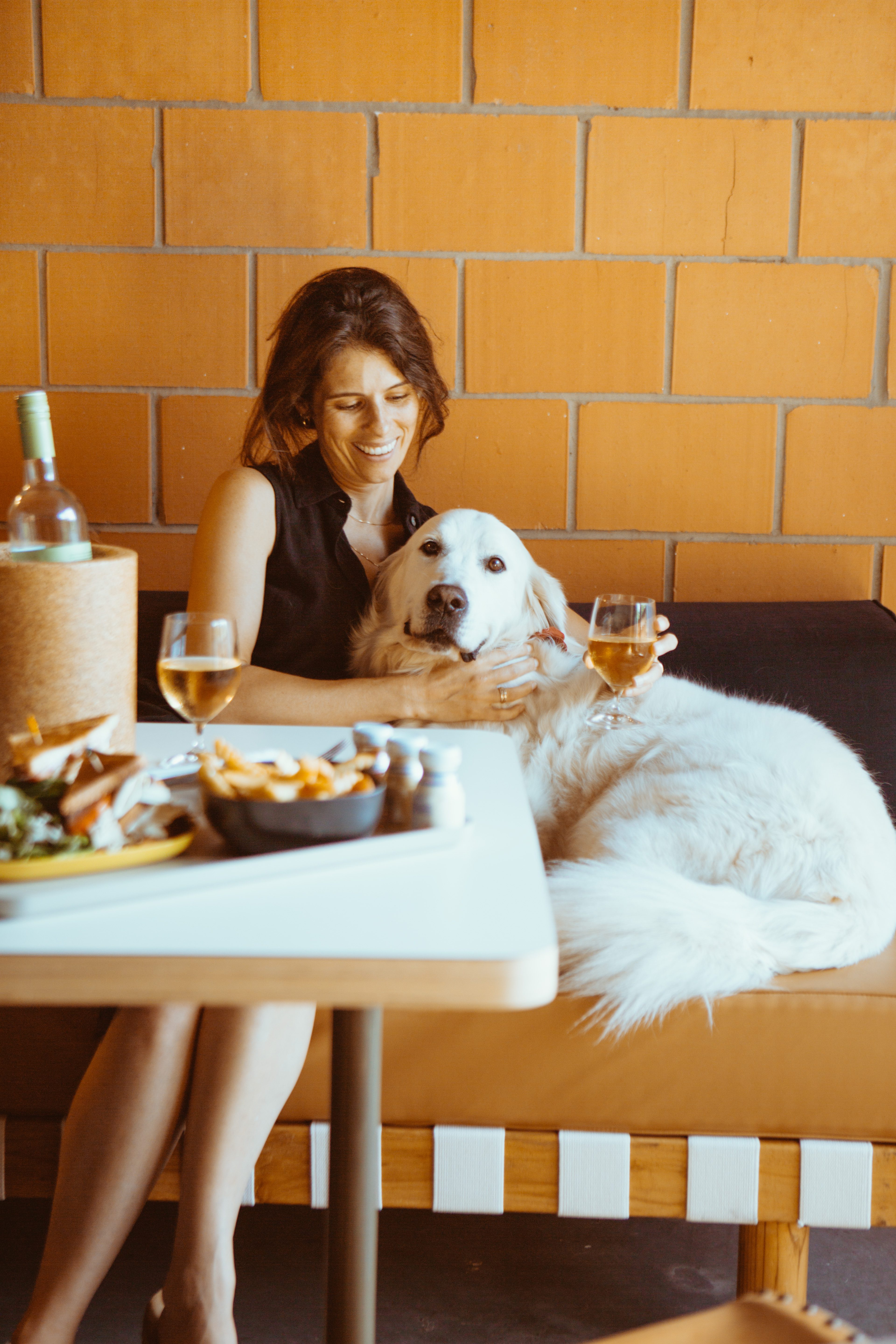 Woman cradling a big white dog